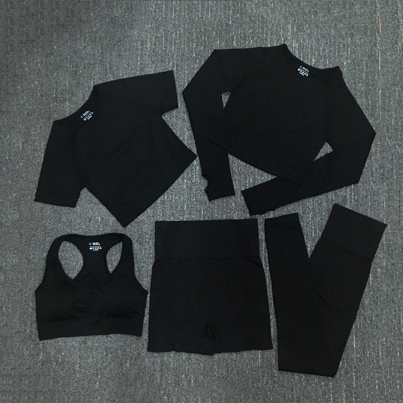 El poliéster de nylon Spandex cosechó la ropa de deportes proveída de costillas desgaste largo del gimnasio del top del entrenamiento de la manga